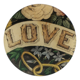 A five inch round glass plate featguring the work 'LOVE' in a font that resemble a wood like feature. Flowers and foliage surround the word.