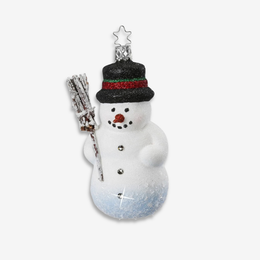 A snowman Christmas ornament with a black glittery hat featuring red and green glitter stripes, holding a small snow-covered broom, on a light gray background.