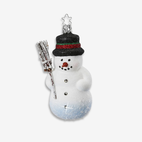 A snowman Christmas ornament with a black glittery hat featuring red and green glitter stripes, holding a small snow-covered broom, on a light gray background.