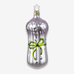 A silver Christmas ornament shaped like a bunch of asparagus decorated with a bright green ribbon bow and a small star topper, shown on a light gray background.