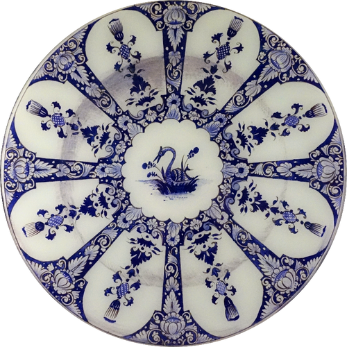 A 16-inch round glass plate with blue and white floral and geometric pattern featuring a swan in the center. 