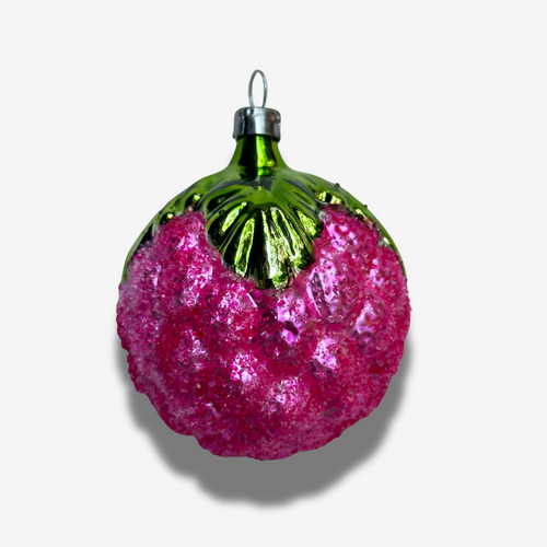 Decorative ornament shaped like a pink berry with a green stem on a white background