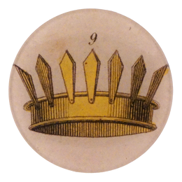 A four inch round plate of a gold crown with 9 points