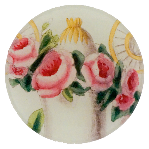 A four inch round plate with pink roses and a carriage design on a white background