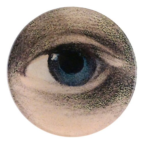 A four inch round plate featuring a close up of a woman's left blue eye 