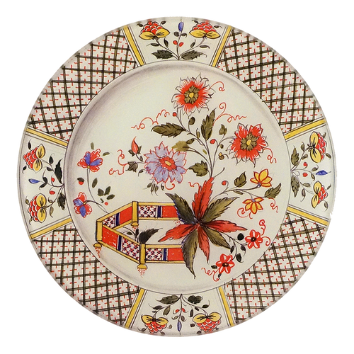 A five inch round glass plate featuring an intricate design compiled of flowers and patterns