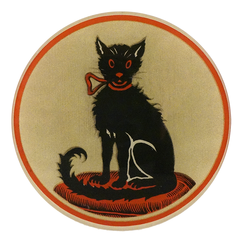 A five inch round glass plate of a black cat sitting on a red pillow on a cream background with red boarder 