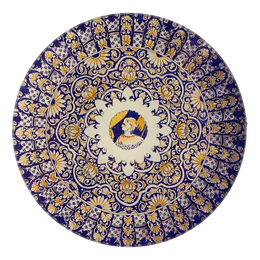 A five inch round glass plate featuring an intricate blue and yellow design. A small sketch of a woman is represented in the center