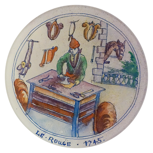 A five inch round handblown glass plate with a scene of a person at a table, tools, and a horse, signed 'Le Rouge 1745'.