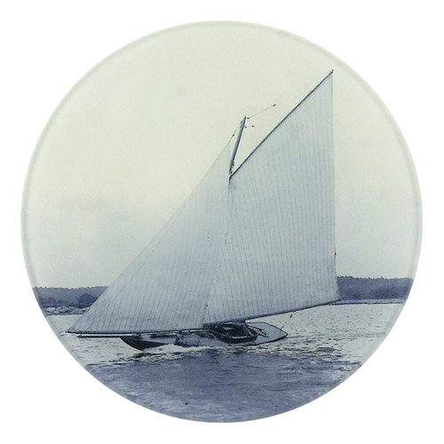 A five inch round plate featuring a vintage illustration of a  reaper sailboat on water, shown against a plain white background.