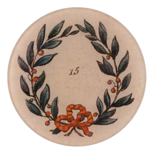 A five inch round glass plate feathering a green wreath with cherries and a red bow. The number 15 shown in the center