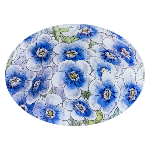 A five inch by seven inch glass plate with blue and white floral pattern. 