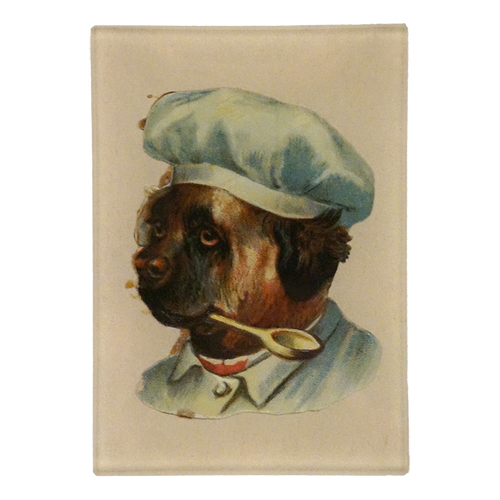 A three and a half inch by five inch rectangular vertical glass tray featuring a vintage-style illustration of a French bulldog wearing a light blue chef's hat and jacket, with a spoon in its mouth, set against a cream-colored background.