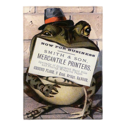 Frog wearing a top hat with a vintage advertisement on its chest against a brick wall background on a three and a half inch by five inch glass tray. 