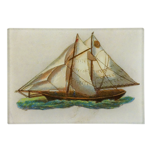 A three and a half inch by five inch horizontal glass tray featuring an illustration of a wooden sailing ship with cream-colored sails and green-blue water, set against a plain white background.