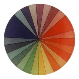 A four inch round plate handcollaged paper design resembling a color spectrum, featuring a variety of solid colors radiating from the center.