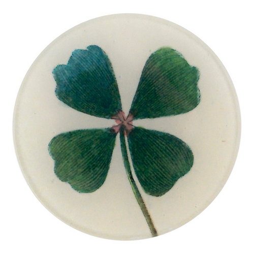 A four inch round plate featuring a four-leaf green clover on a white background
