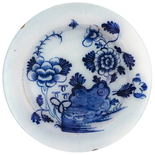 A ten inch round glass plate featuring blue sketch illustration on a white background. 