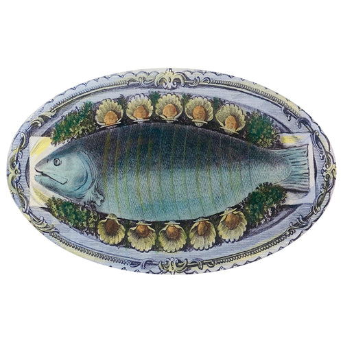 A nine inch by fourteen inch horizontal  oval glass plate featuring an illustration of a fish on platter.