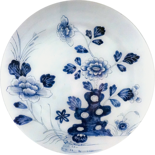 A 16-inch round glass plate featuring a blue floral design on a white background. 