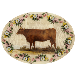 A thirteen inch by eighteen inch horizontal oval glass plate of a brown bull surrounded by a floral boarder. 