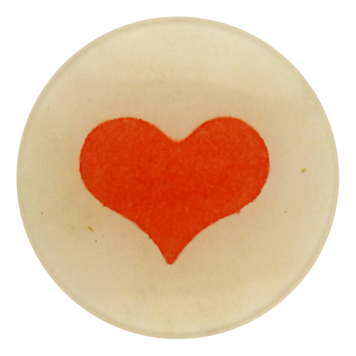 A four inch round homemade decoupage plate featuring a wide red heart 