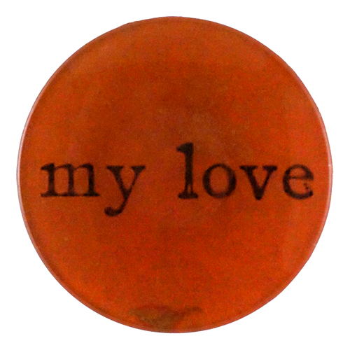 A 4-inch round orange plate with the text 'my love' in a bold, black font positioned towards the bottom.