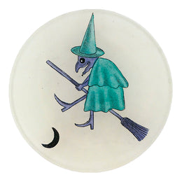 A four inch round plate featuring a vintage drawing of a purple and green witch 