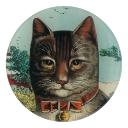 A five inch round glass plate featuring a collage of a cat's face wearing a red bow with a gold bell. 