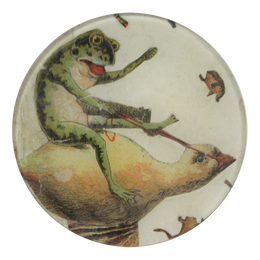 A five inch round glass plate featuring a frog riding a duck with smaller frogs around.
