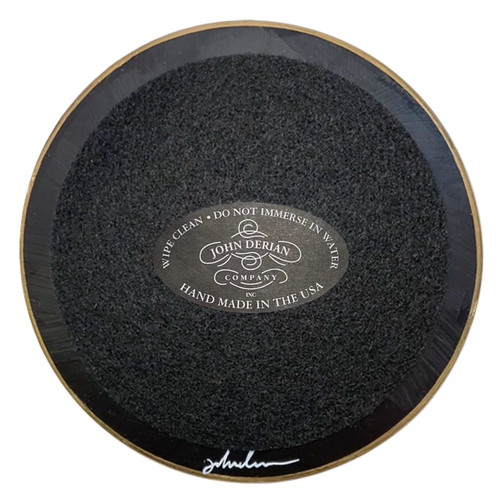The back of a five inch round plate with lack paint and black felt. Featuring the signature John Derian Company sticker and signed by John Derian.  