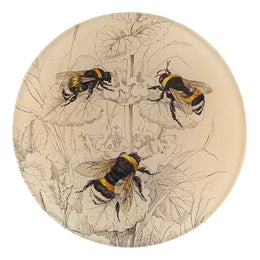A five inch round glass plate with a collaged paper design featuring common bumble bees on a floral pattern.