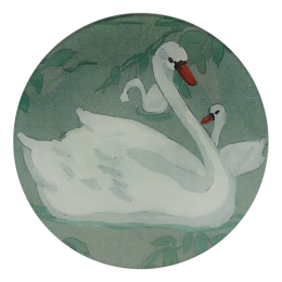 A five inch round glass plate featuring white swans and green foliage.