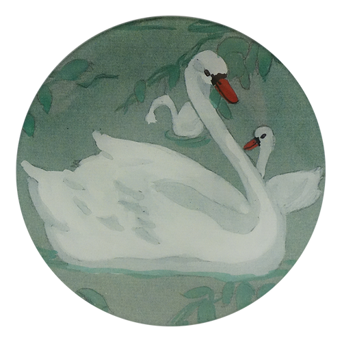 A five inch round glass plate featuring white swans and green foliage.