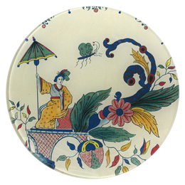 A seven inch round glass plate featuring a person in traditional attire under a umbrella, surrounded by floral and fantastical motifs.