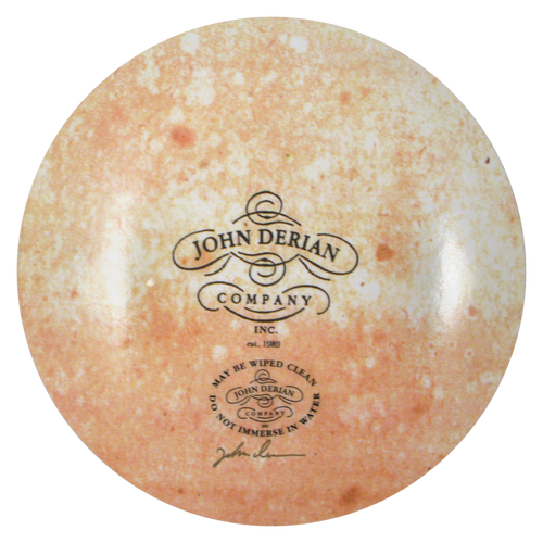 The back of a seven inch round plate  featuring the signature John Derian Company sticker and signed by John Derian. 