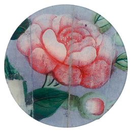 A five inch round plate featuring a vintage style pink flower on blue background 