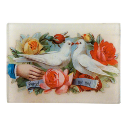 A glass tray featuring an artistic representation of two doves among various flowers with the text 'Forget me not' on it.